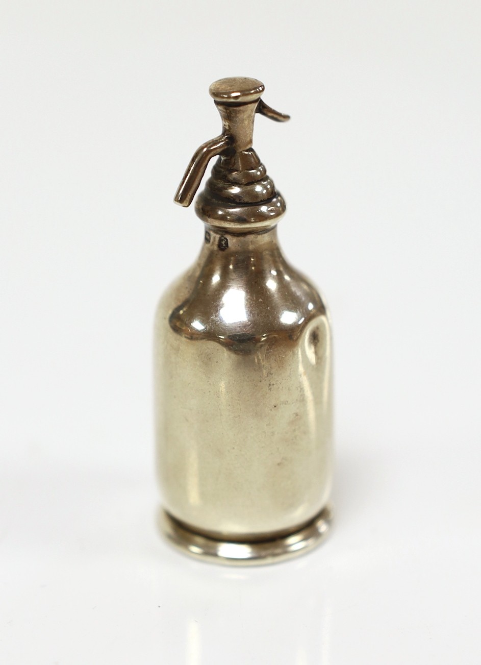 An Edwardian miniature silver model of a soda syphon, Saunders & Shepherd, Birmingham, 1906, 62mm.